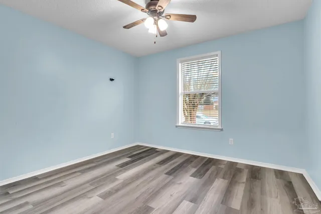 a view of room with window and ceiling fan