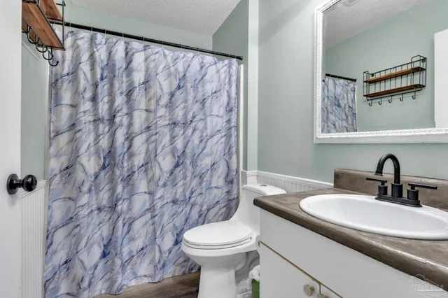 a bathroom with a sink and a toilet