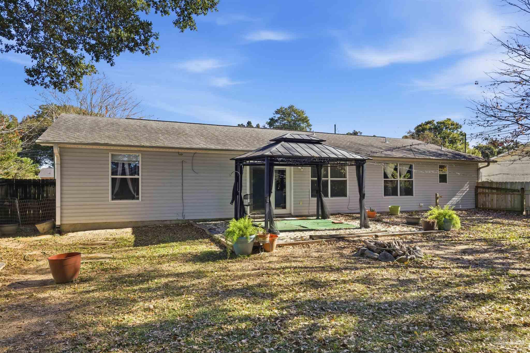4331 Chantilly Way Milton, FL 32583 - Photo 26 of 30 a front view of a house with a yard