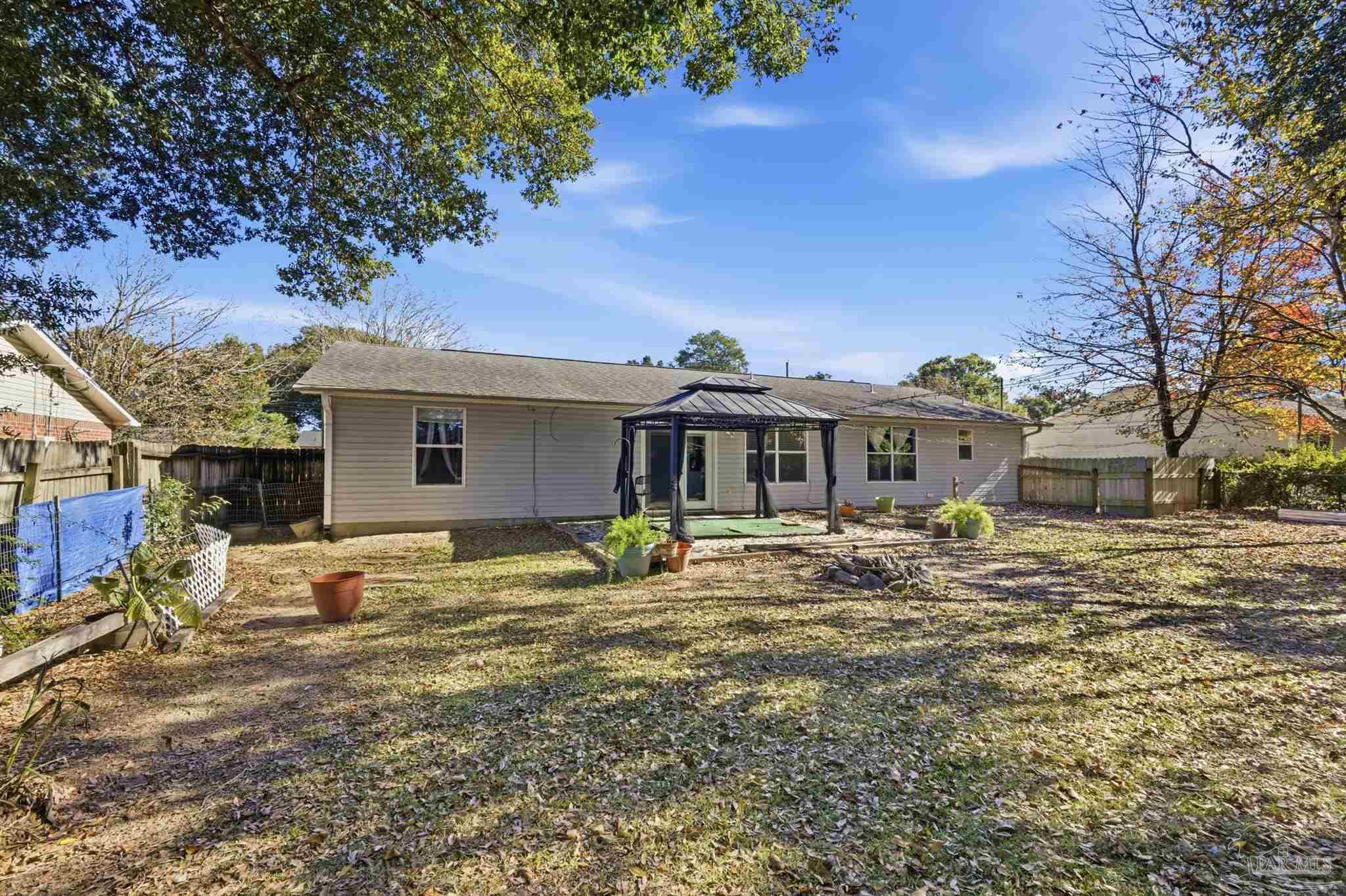 4331 Chantilly Way Milton, FL 32583 - Photo 28 of 30 a front view of a house with garden