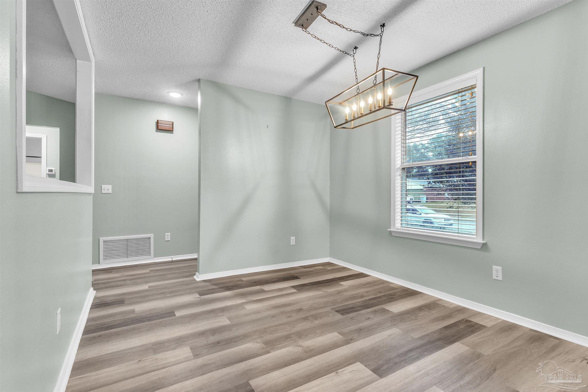 4331 Chantilly Way Milton, FL 32583 - Photo 7 of 30 a view of an empty room with a window