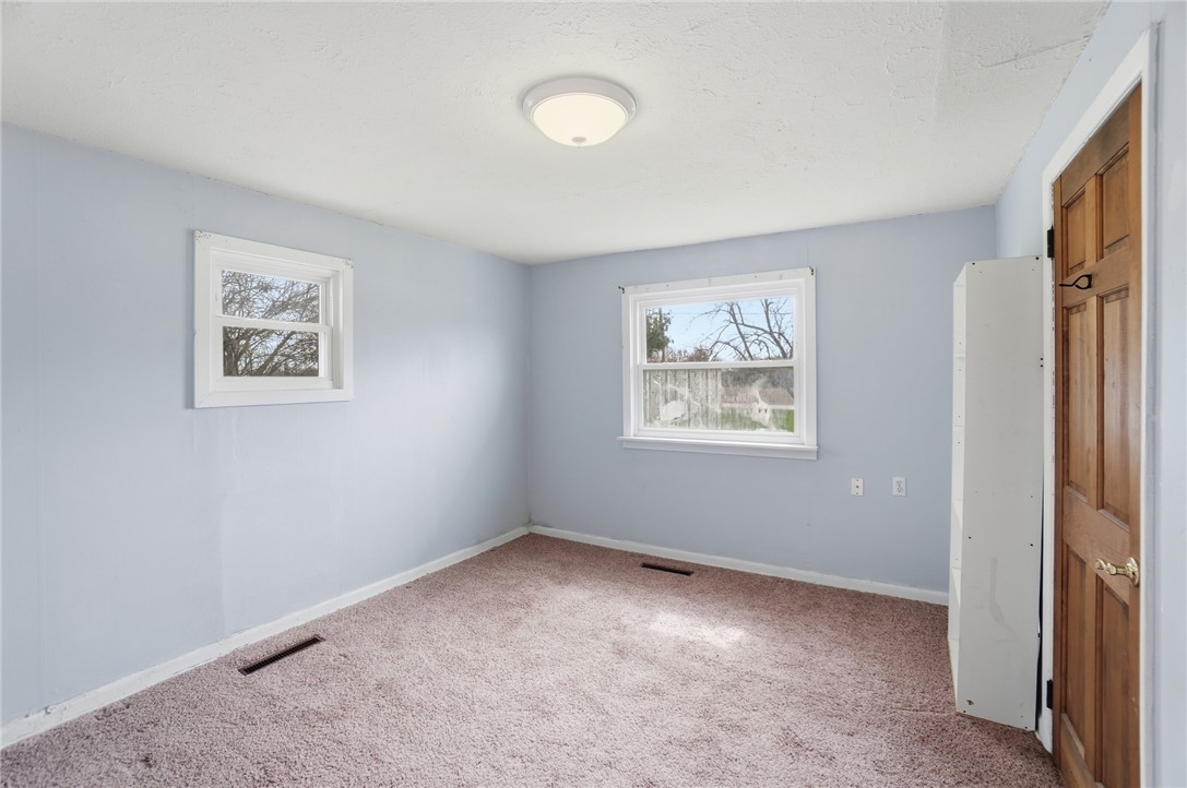 1166 West Sparrow Road Springfield, OH 45502 - Photo 16 of 40 This cozy bedroom offers a tranquil retreat with ample natural light.