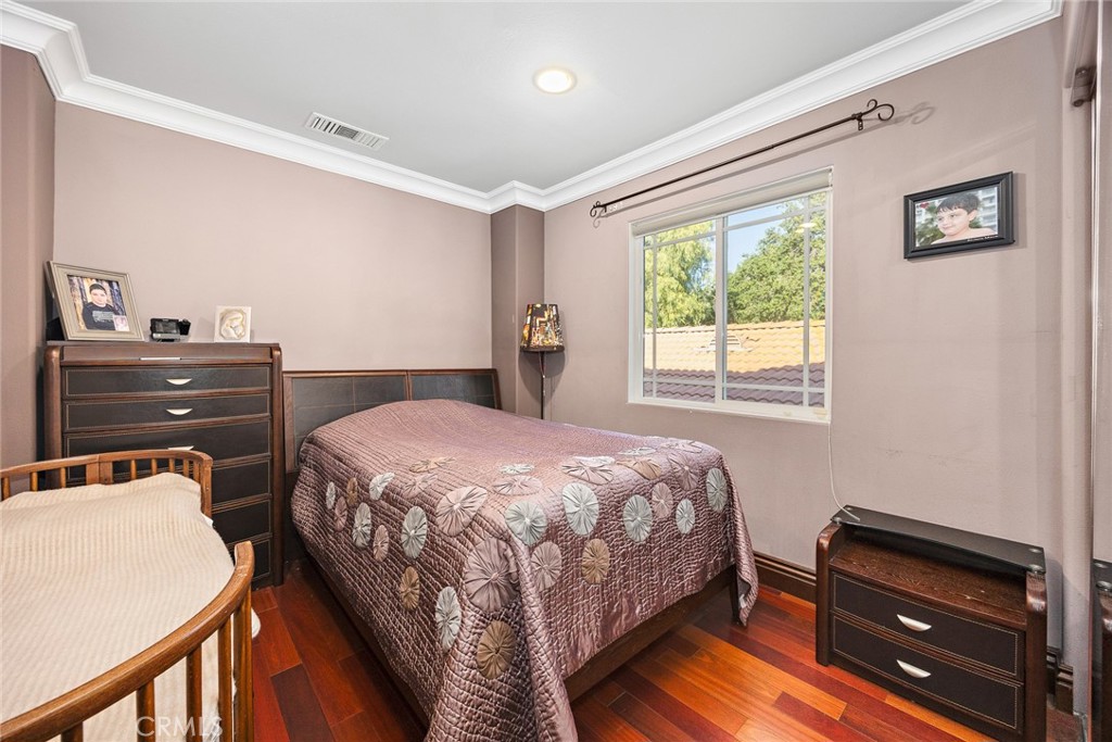10610 Oak Tree Way Sunland, CA 91040 - Photo 32 of 63 a bedroom with a bed and a dresser