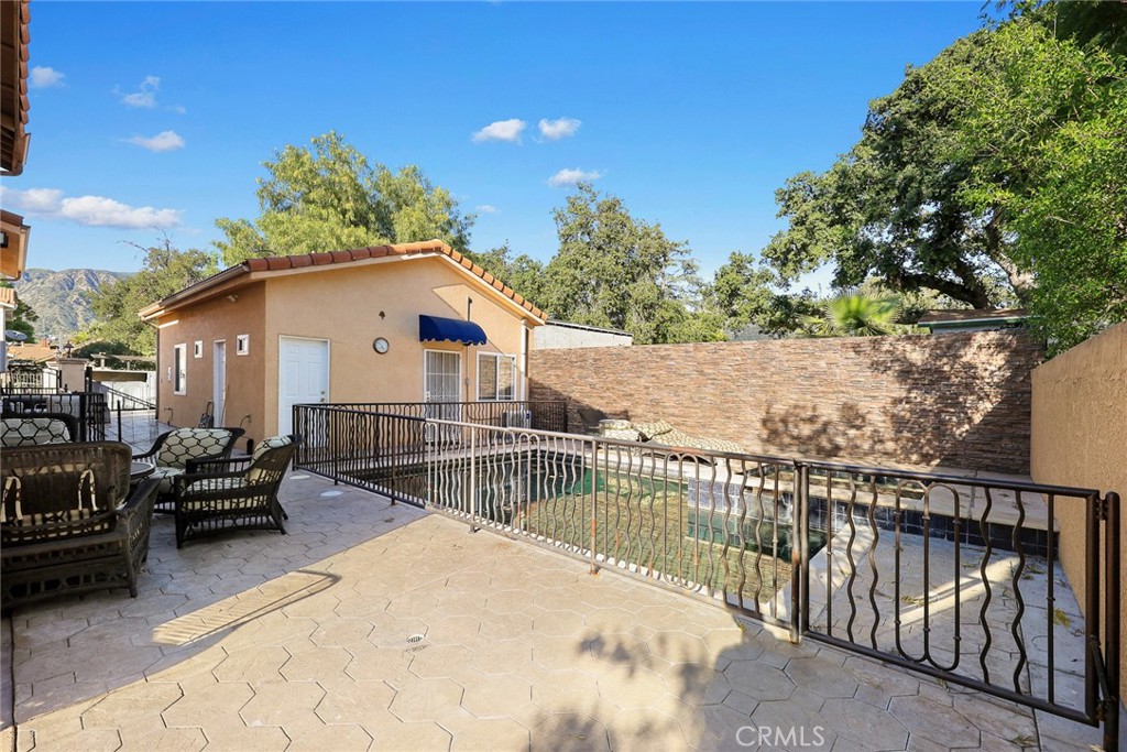 10610 Oak Tree Way Sunland, CA 91040 - Photo 33 of 63 a view of a house with wooden deck and furniture