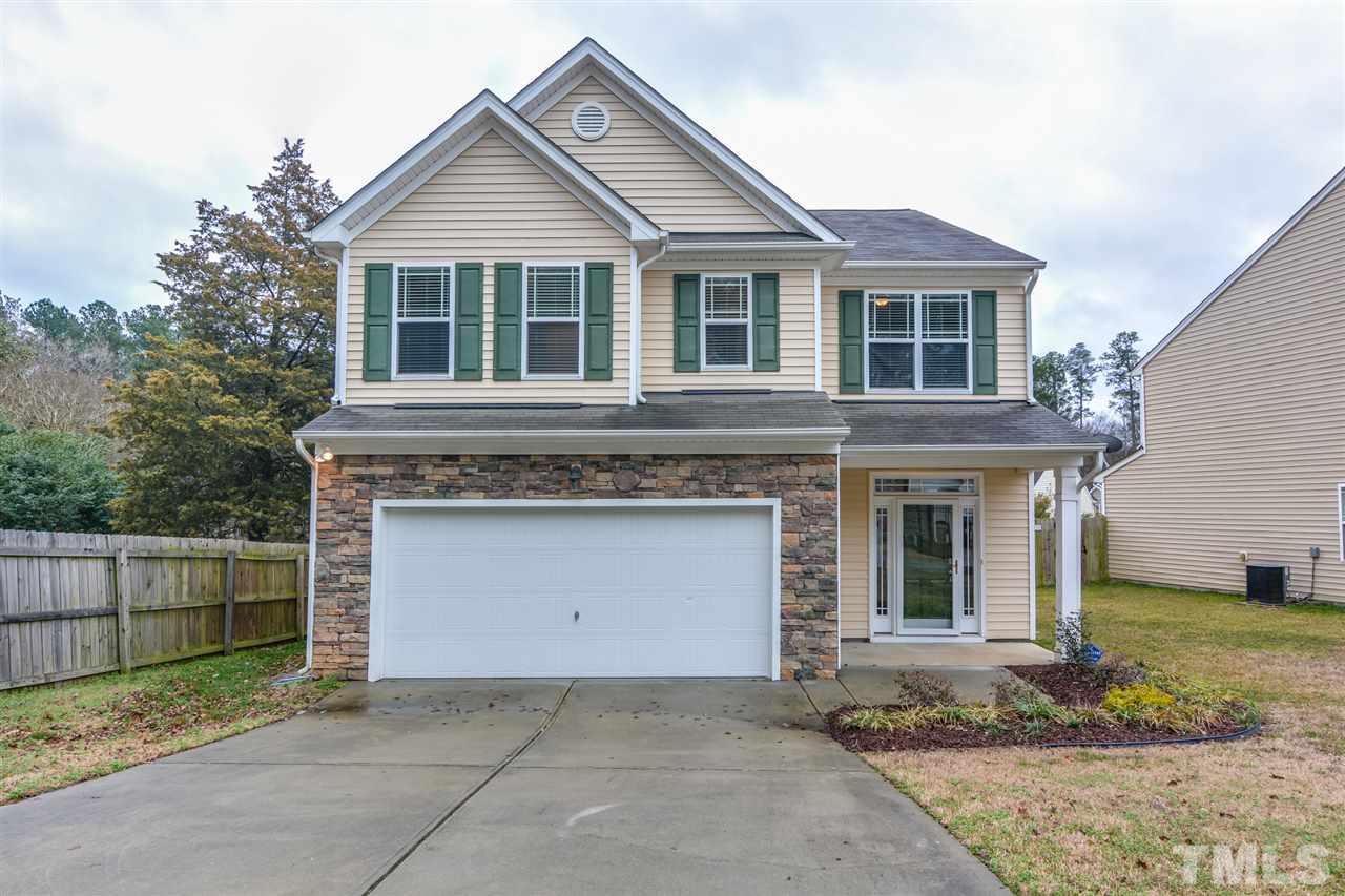 3630 Eastern Branch Road Raleigh, NC 27610 - Photo 1 of 25 a front view of a house with a yard and garage