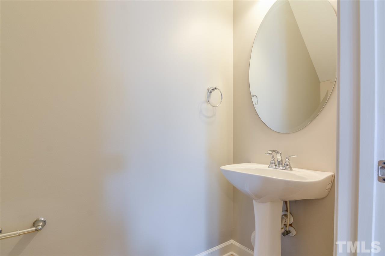 3630 Eastern Branch Road Raleigh, NC 27610 - Photo 21 of 25 a bathroom with a sink and mirror