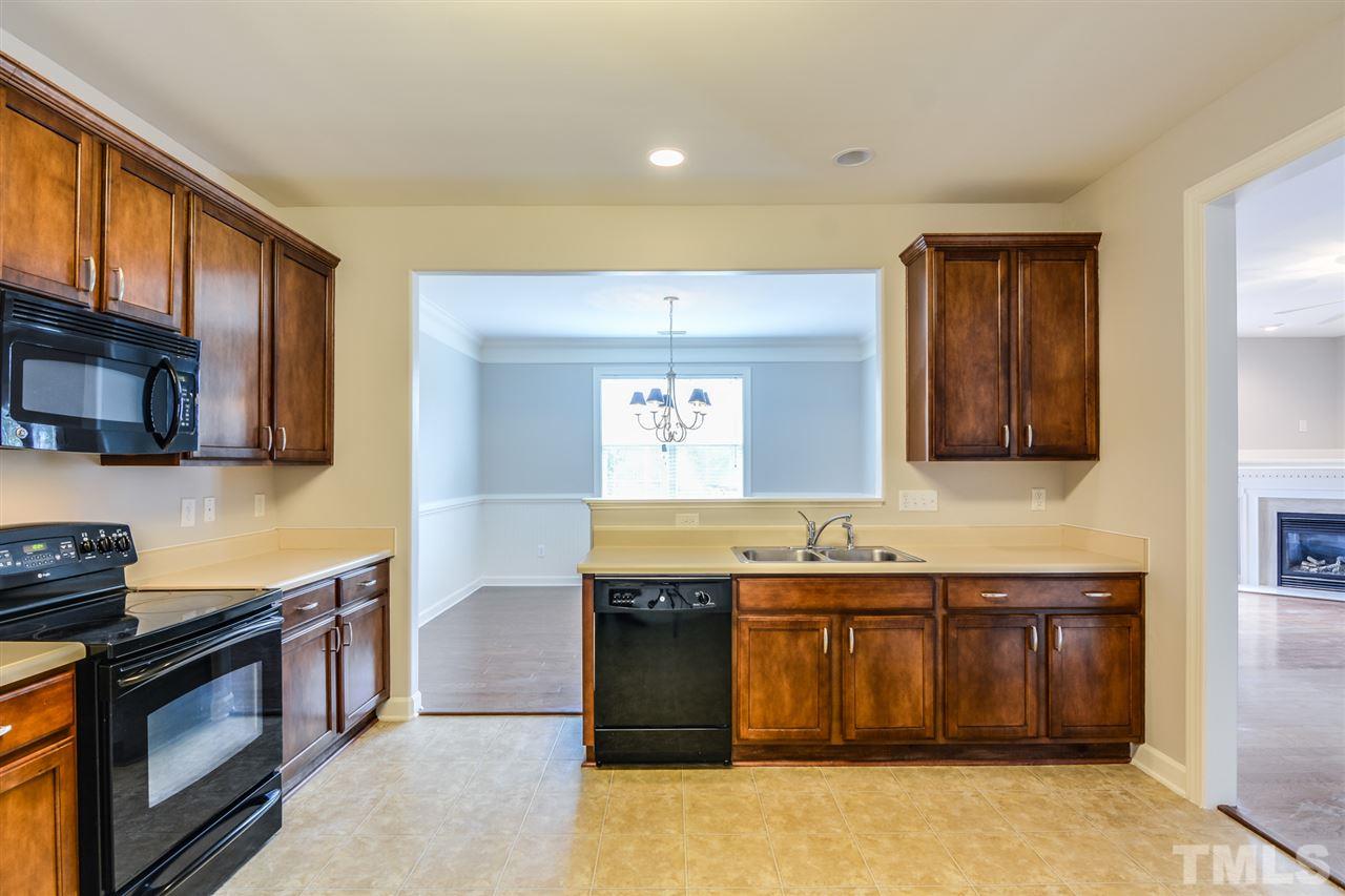 3630 Eastern Branch Road Raleigh, NC 27610 - Photo 4 of 25 a kitchen with a stove and a sink
