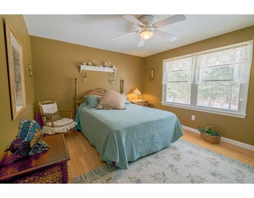44 Old Reed Road Monson, MA 01057 - Photo 22 of 30 a bedroom with a bed window and a chandelier