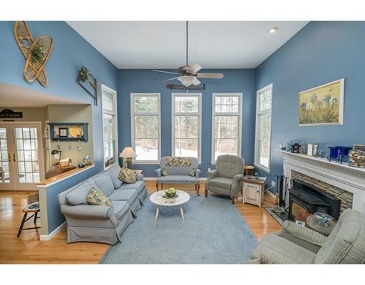 44 Old Reed Road Monson, MA 01057 - Photo 5 of 30 a living room with furniture a fireplace and a chandelier