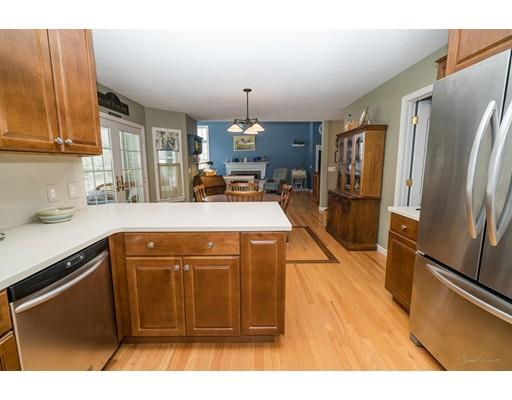 44 Old Reed Road Monson, MA 01057 - Photo 10 of 30 a kitchen with stainless steel appliances granite countertop a refrigerator a sink dishwasher a stove with wooden cabinets