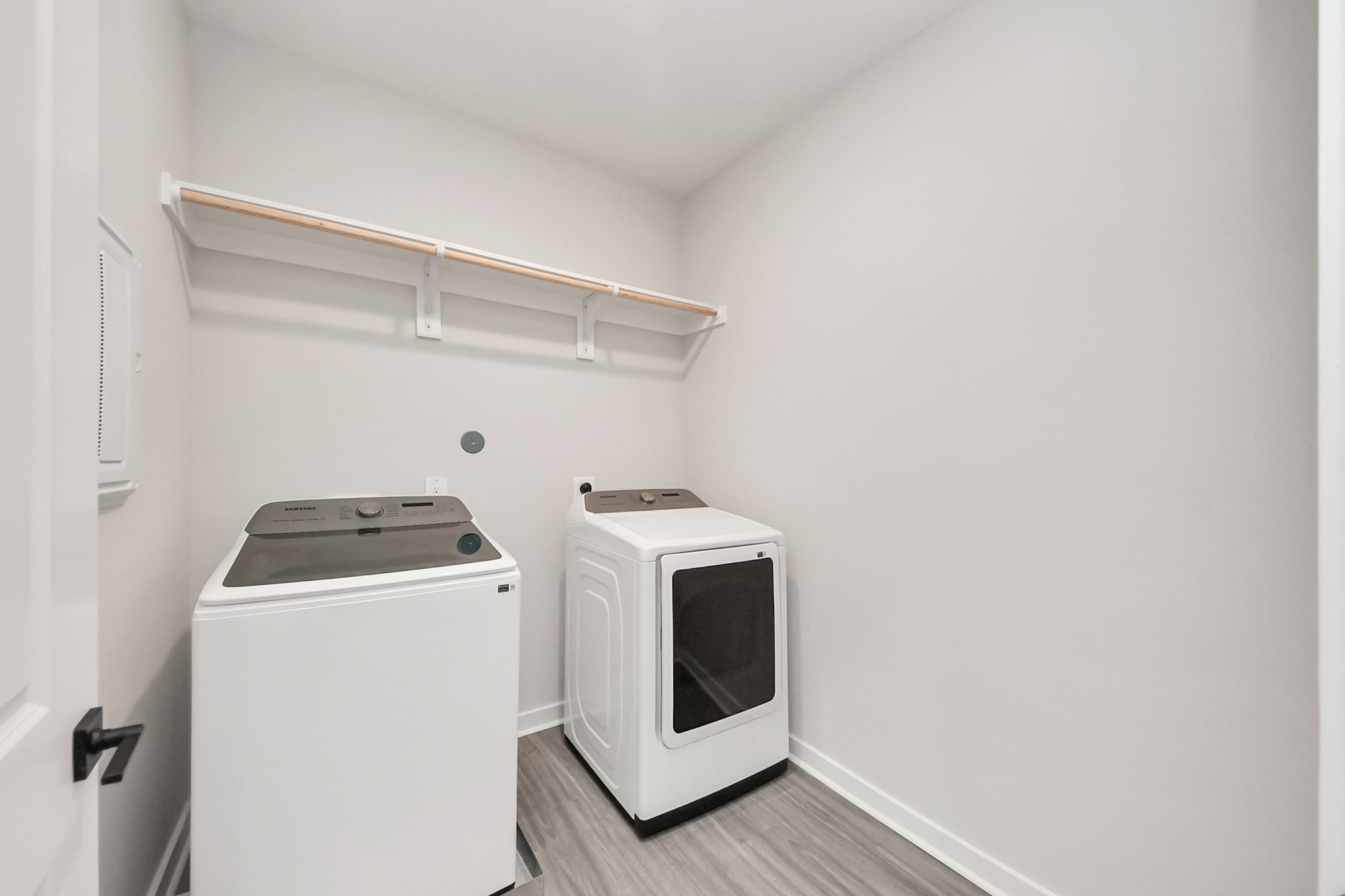 7711 Longmire Road, Unit 102 Conroe, TX 77304 - Photo 7 of 48 a utility room with dryer and washer