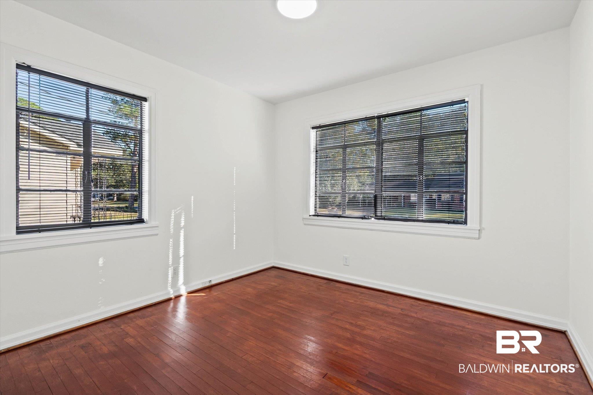 2806 Exter Drive Mobile, AL 36606 - Photo 11 of 24 Unfurnished room featuring dark wood finished floors and baseboards