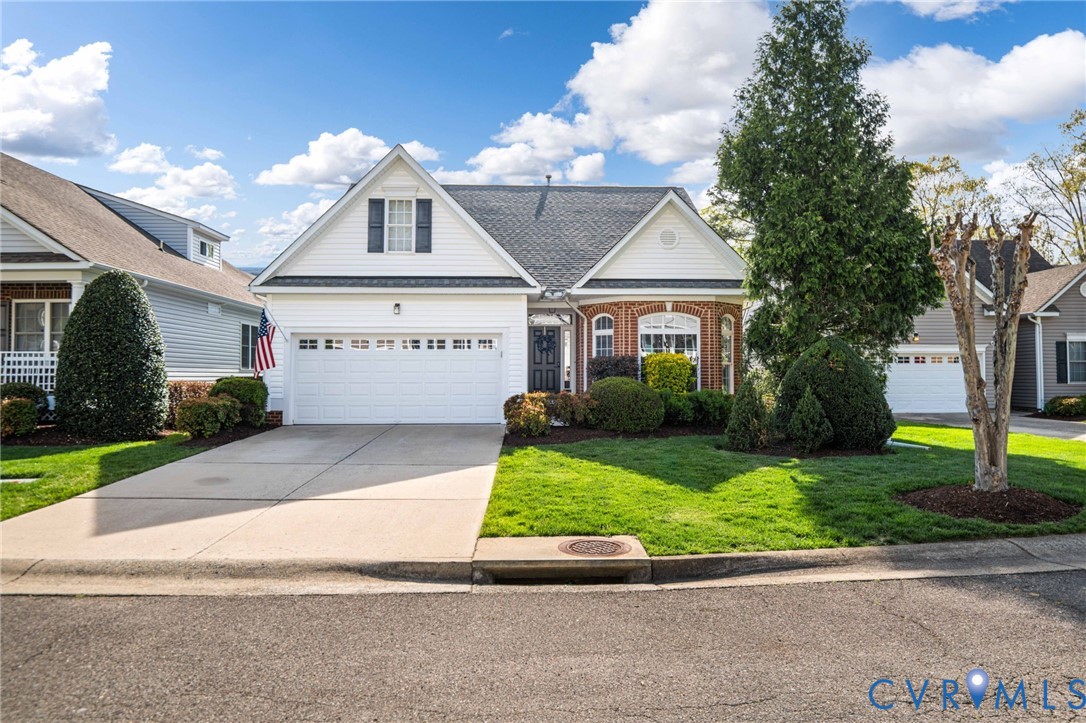 a view of front of house with a yard