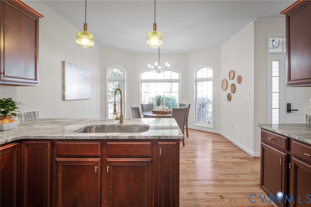 1024 Alcorn Terrace Midlothian, VA 23114 - Photo 13 of 50 a kitchen with kitchen island granite countertop a sink stainless steel appliances and cabinets