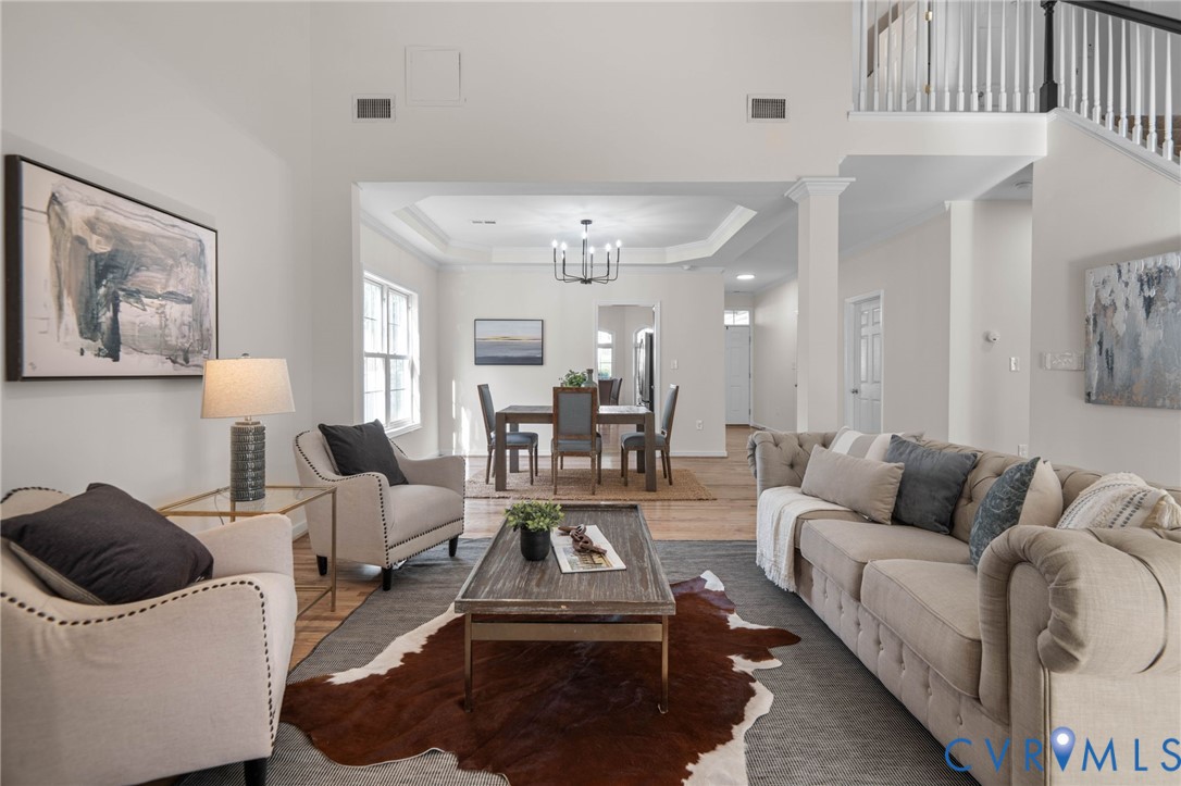 1024 Alcorn Terrace Midlothian, VA 23114 - Photo 24 of 50 a living room with furniture and a chandelier