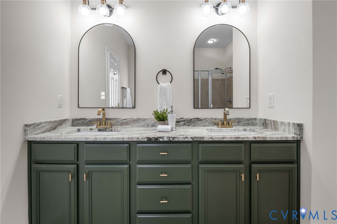 1024 Alcorn Terrace Midlothian, VA 23114 - Photo 32 of 50 a bathroom with a granite countertop sink a large mirror and a