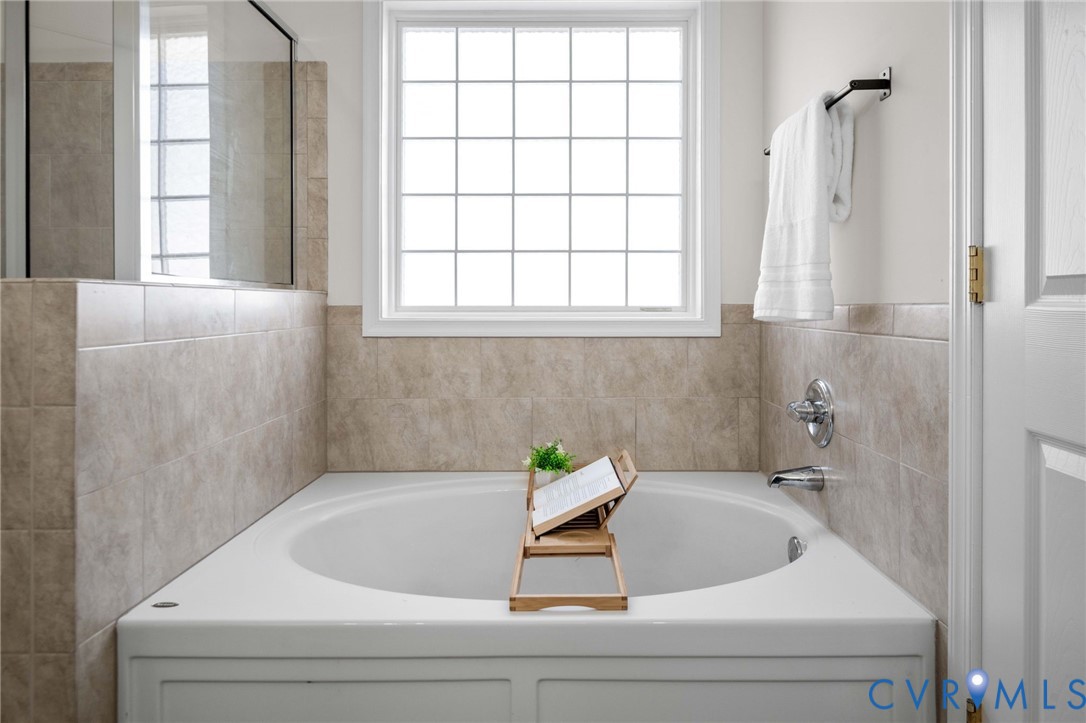 1024 Alcorn Terrace Midlothian, VA 23114 - Photo 34 of 50 a bathroom with a bathtub and a window