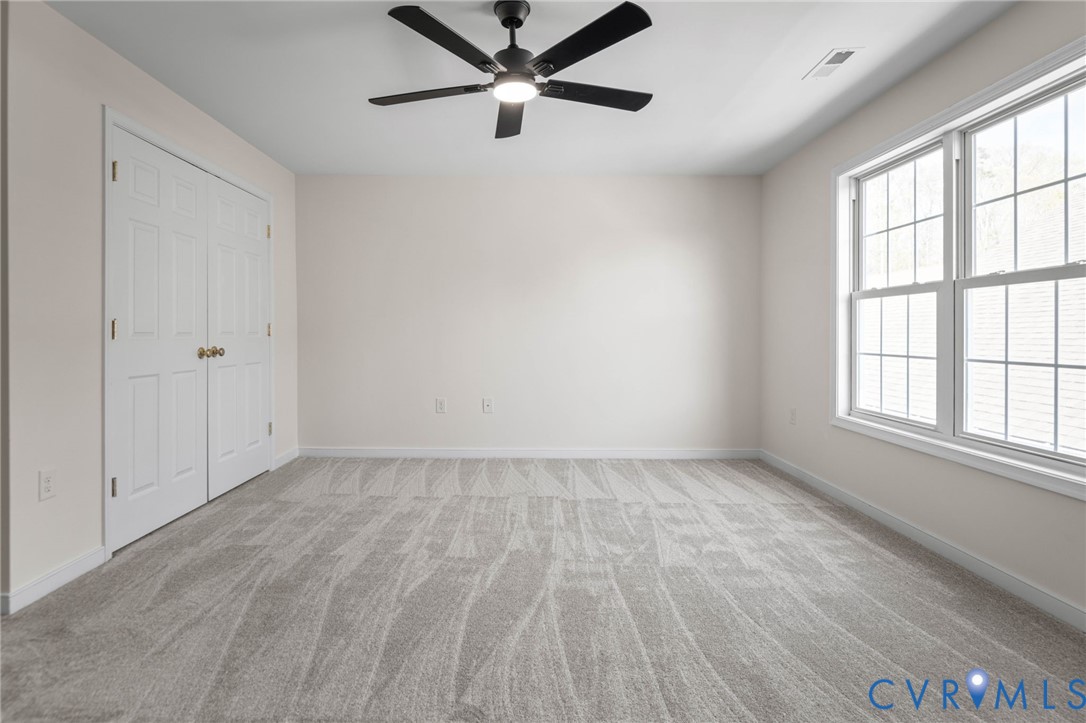 1024 Alcorn Terrace Midlothian, VA 23114 - Photo 41 of 50 an empty room with a window and a fan