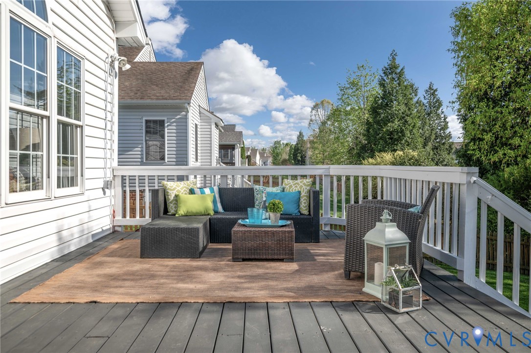 1024 Alcorn Terrace Midlothian, VA 23114 - Photo 49 of 50 a view of a deck with couches table and chairs and wooden floor