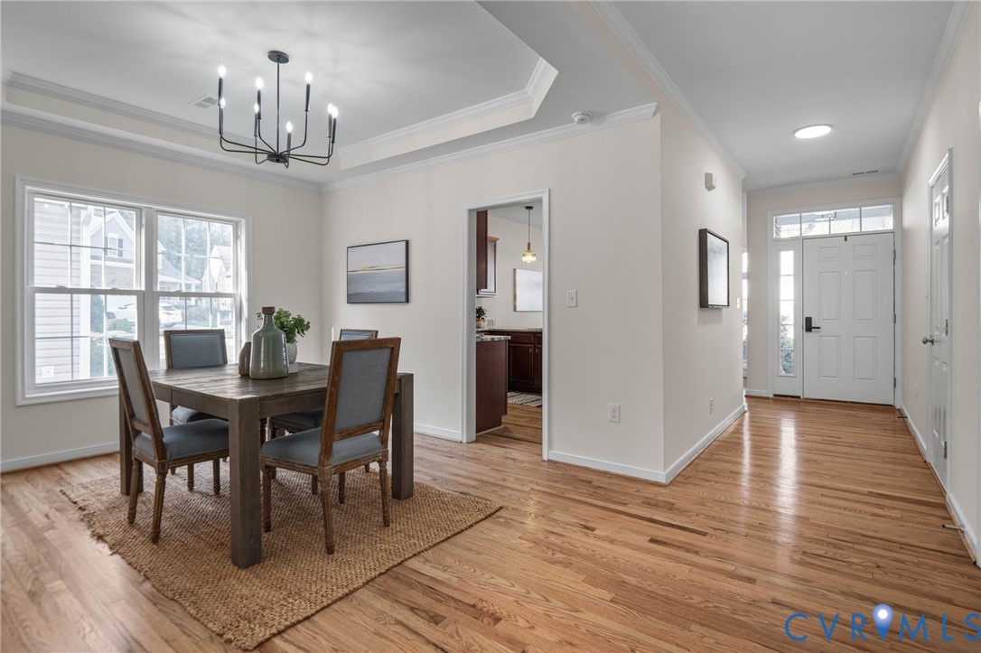 1024 Alcorn Terrace Midlothian, VA 23114 - Photo 6 of 50 a view of a dining room with furniture a chandelier and wooden floor