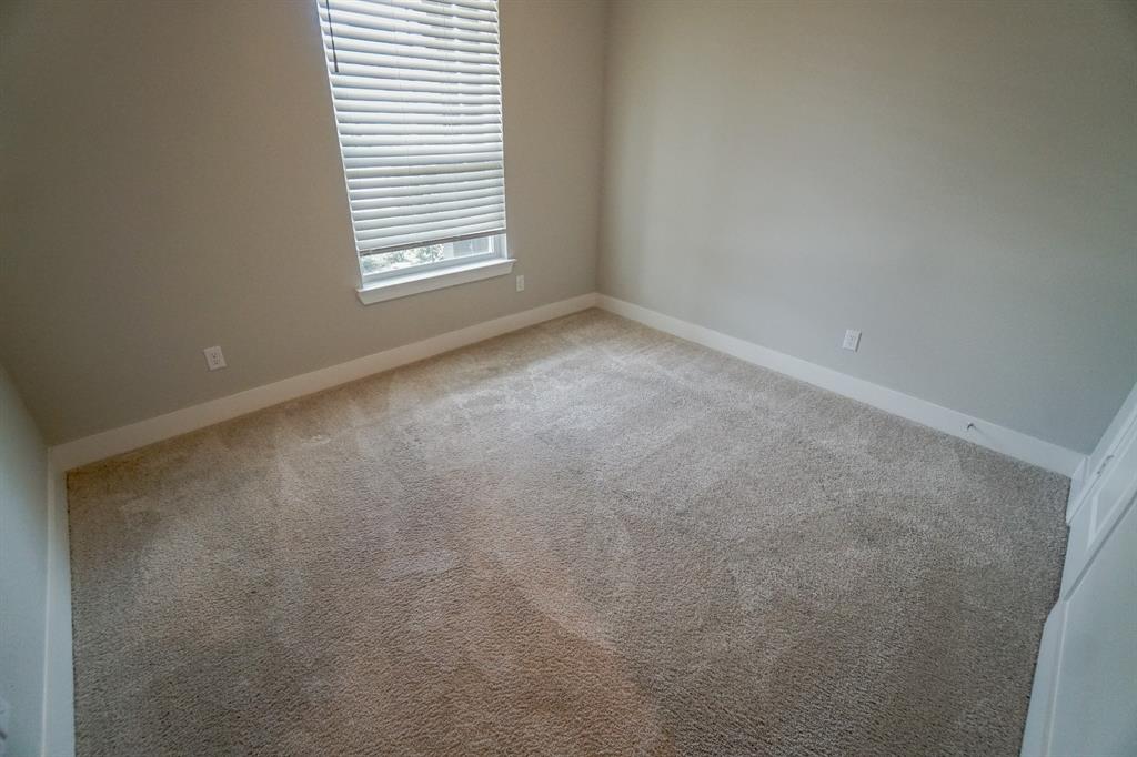 1309 Old Rocksprings Pass Mansfield, TX 76063 - Photo 21 of 36 Neutral-toned carpeting extends throughout this room, complemented by light gray walls and white trim