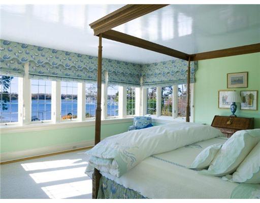 158 Indian Head Road Riverside, CT 06878 - Photo 8 of 10 a bed sitting in a bedroom next to a large window