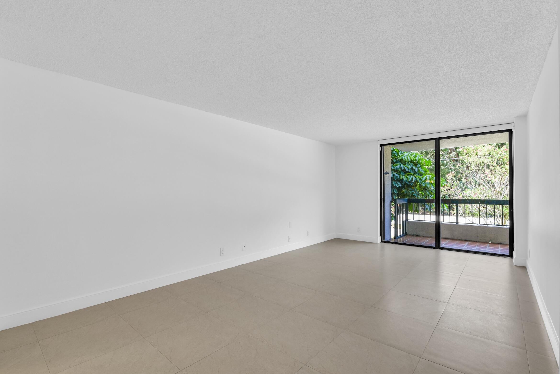 277 North Ocean Boulevard, Unit 1010 Boca Raton, FL 33432 - Photo 15 of 30 an empty room with large windows