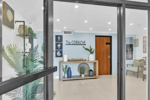 a front view of a building with garden