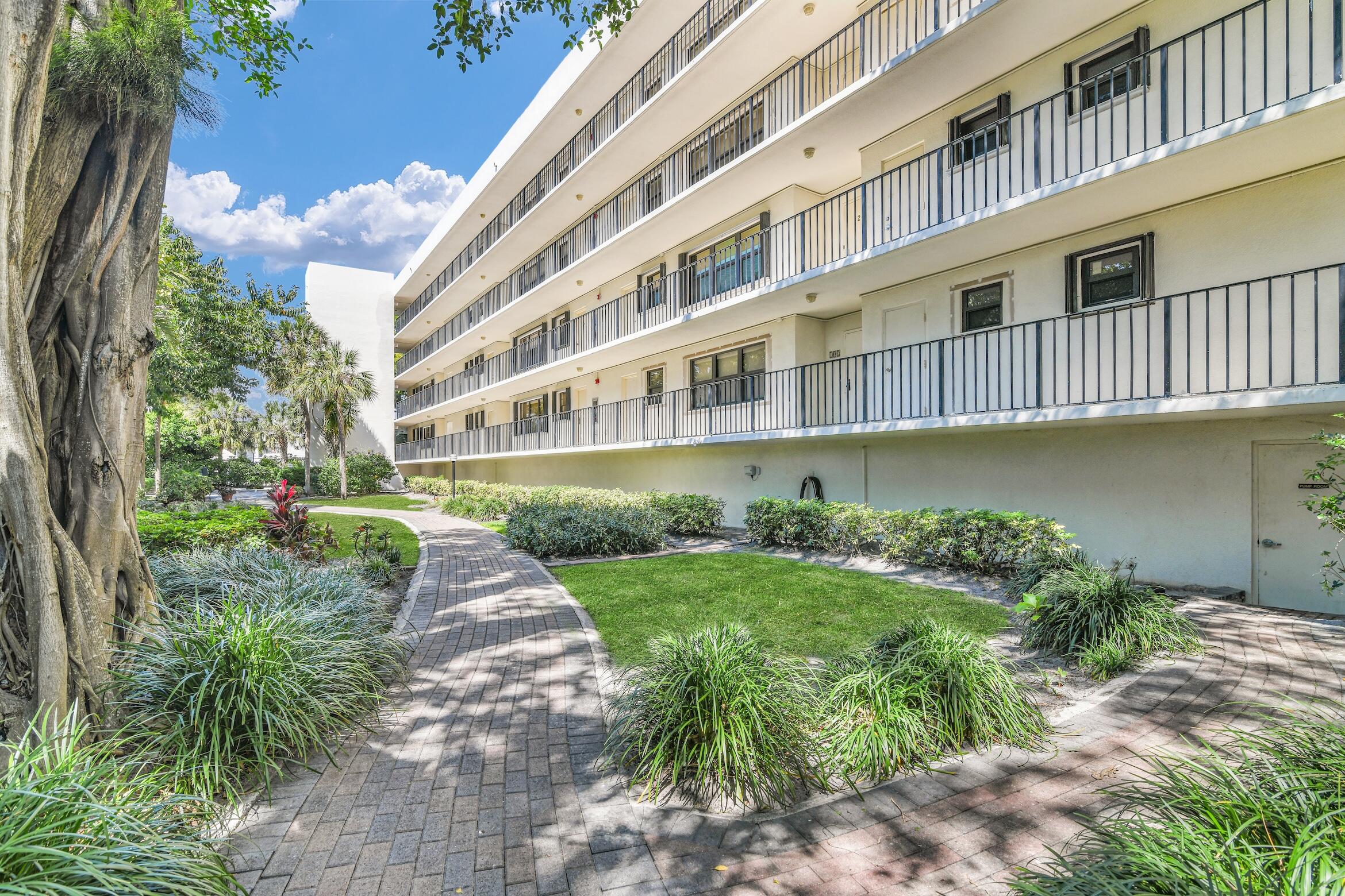 277 North Ocean Boulevard, Unit 1010 Boca Raton, FL 33432 - Photo 23 of 30 a front view of a building with garden