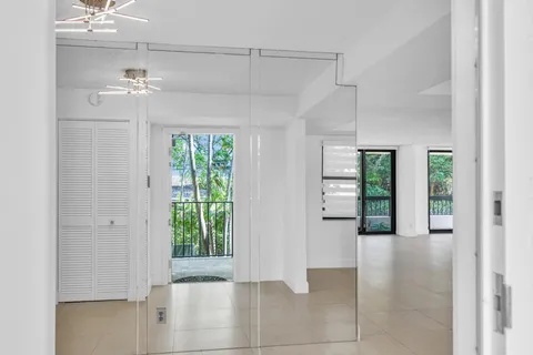 a view interior of a house with wooden floor and a ceiling fan