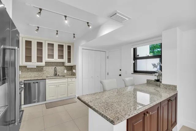 a view of an empty room with windows