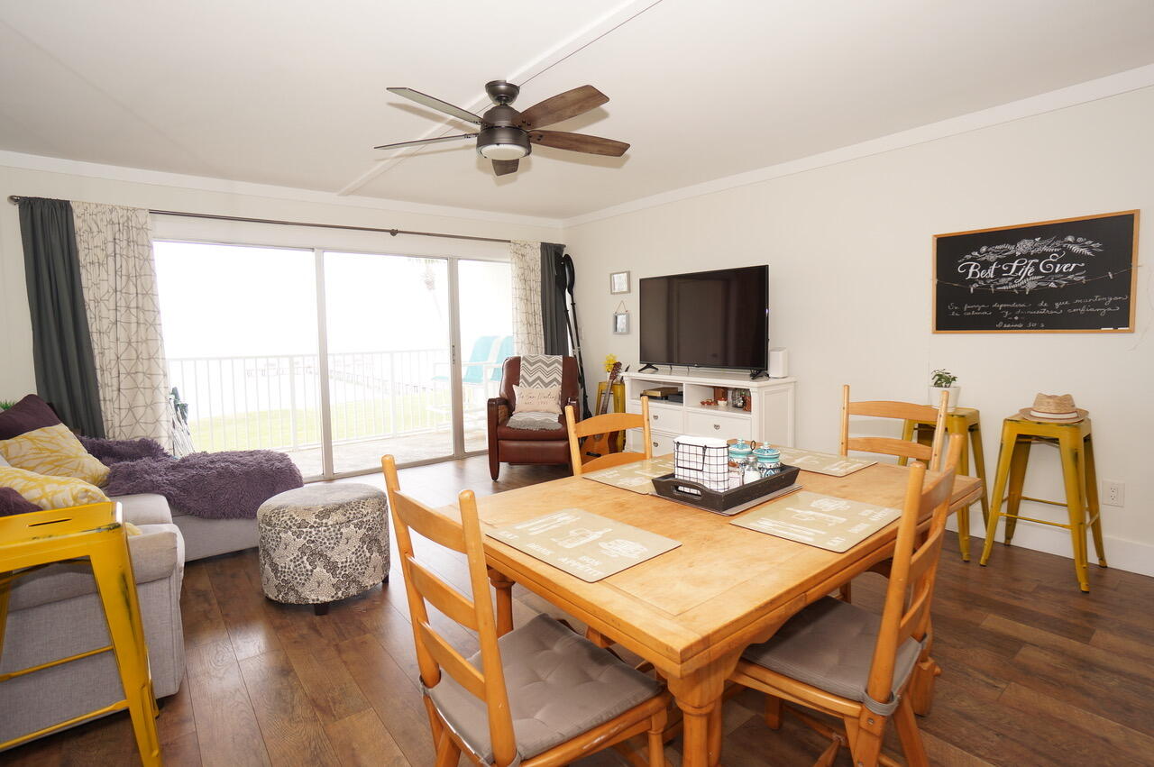 151 Calhoun Avenue, Unit 201 Destin, FL 32541 - Photo 12 of 55 a view of a dining room with furniture window and wooden floor