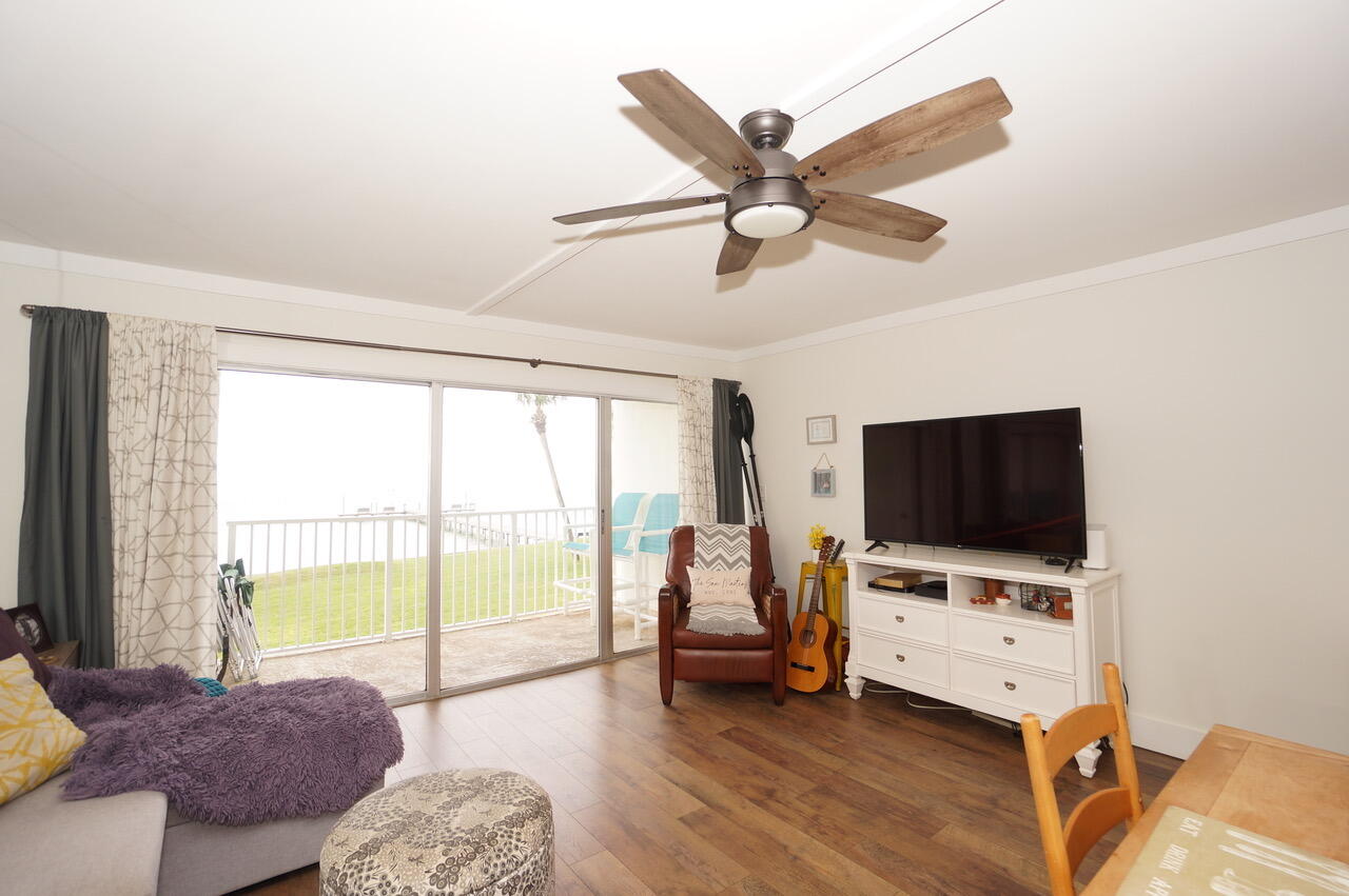 151 Calhoun Avenue, Unit 201 Destin, FL 32541 - Photo 13 of 55 a living room with furniture and a flat screen tv