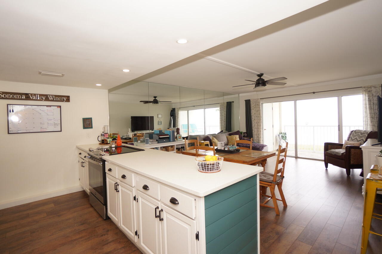151 Calhoun Avenue, Unit 201 Destin, FL 32541 - Photo 16 of 55 a view of a kitchen counter space a sink a window and wooden floor