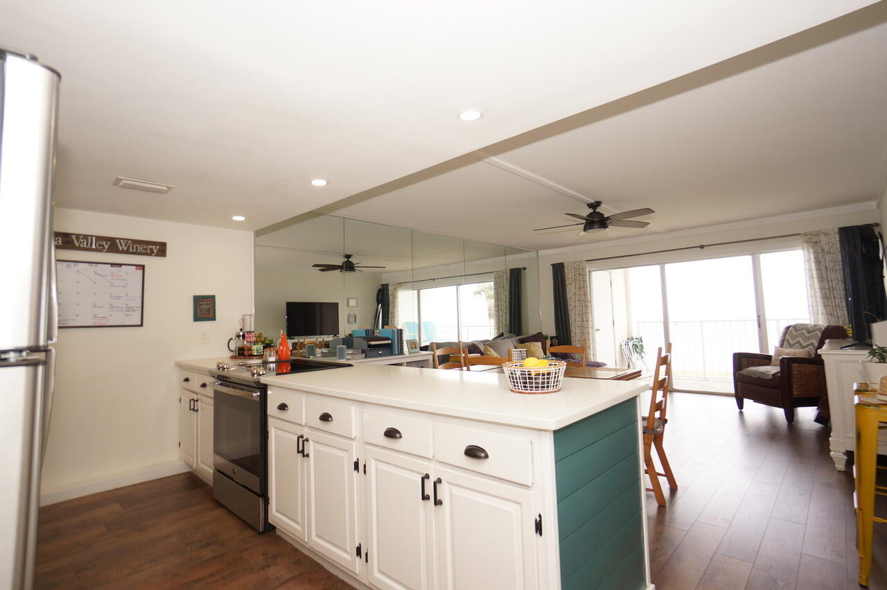 151 Calhoun Avenue, Unit 201 Destin, FL 32541 - Photo 17 of 55 a kitchen with a sink stove and cabinets