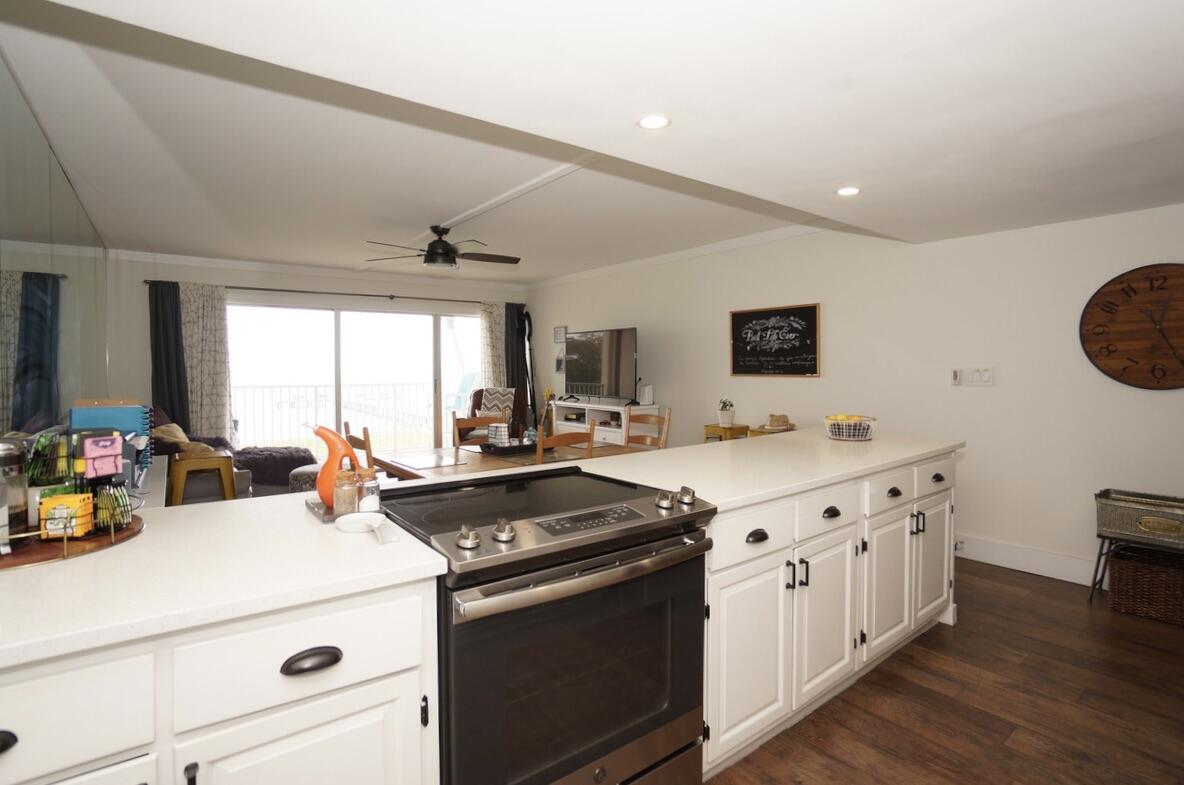 151 Calhoun Avenue, Unit 201 Destin, FL 32541 - Photo 18 of 55 a kitchen with a sink appliances and cabinets