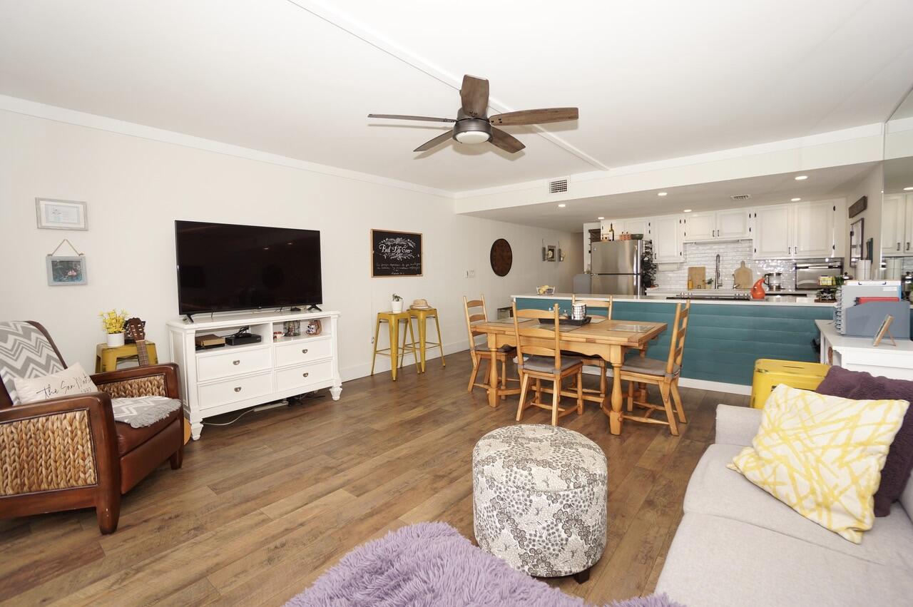 151 Calhoun Avenue, Unit 201 Destin, FL 32541 - Photo 20 of 55 a living room with furniture and a flat screen tv