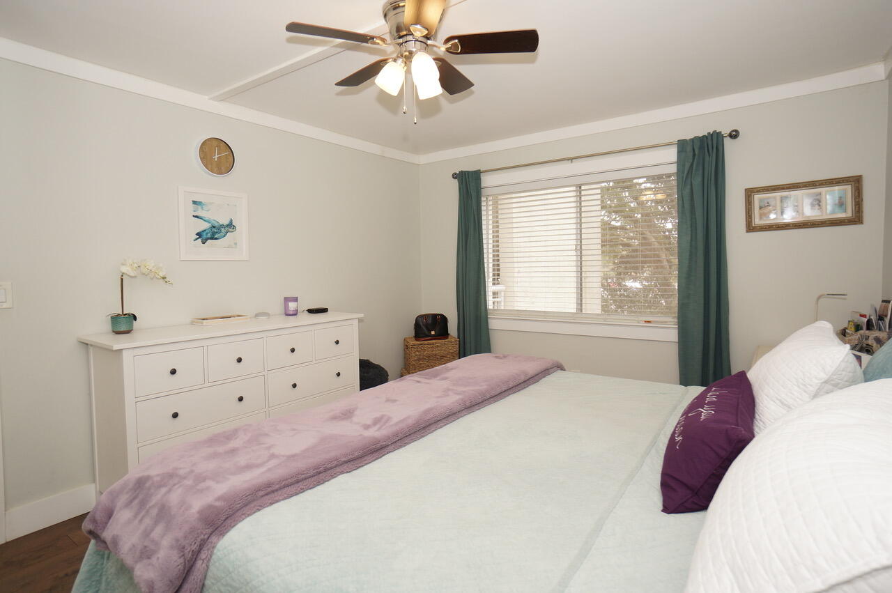 151 Calhoun Avenue, Unit 201 Destin, FL 32541 - Photo 24 of 55 a bedroom with a bed and a window