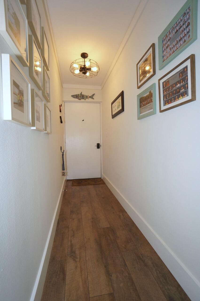 151 Calhoun Avenue, Unit 201 Destin, FL 32541 - Photo 27 of 55 a view of livingroom with hallway
