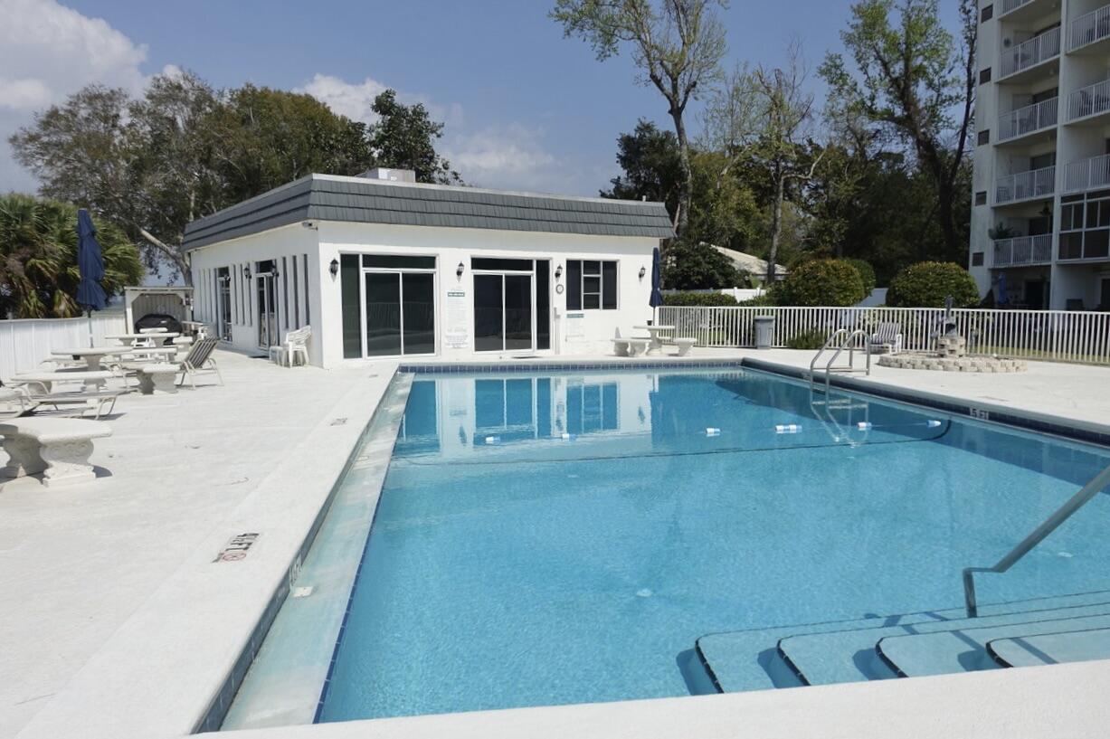 151 Calhoun Avenue, Unit 201 Destin, FL 32541 - Photo 49 of 55 a view of a house with backyard and sitting area
