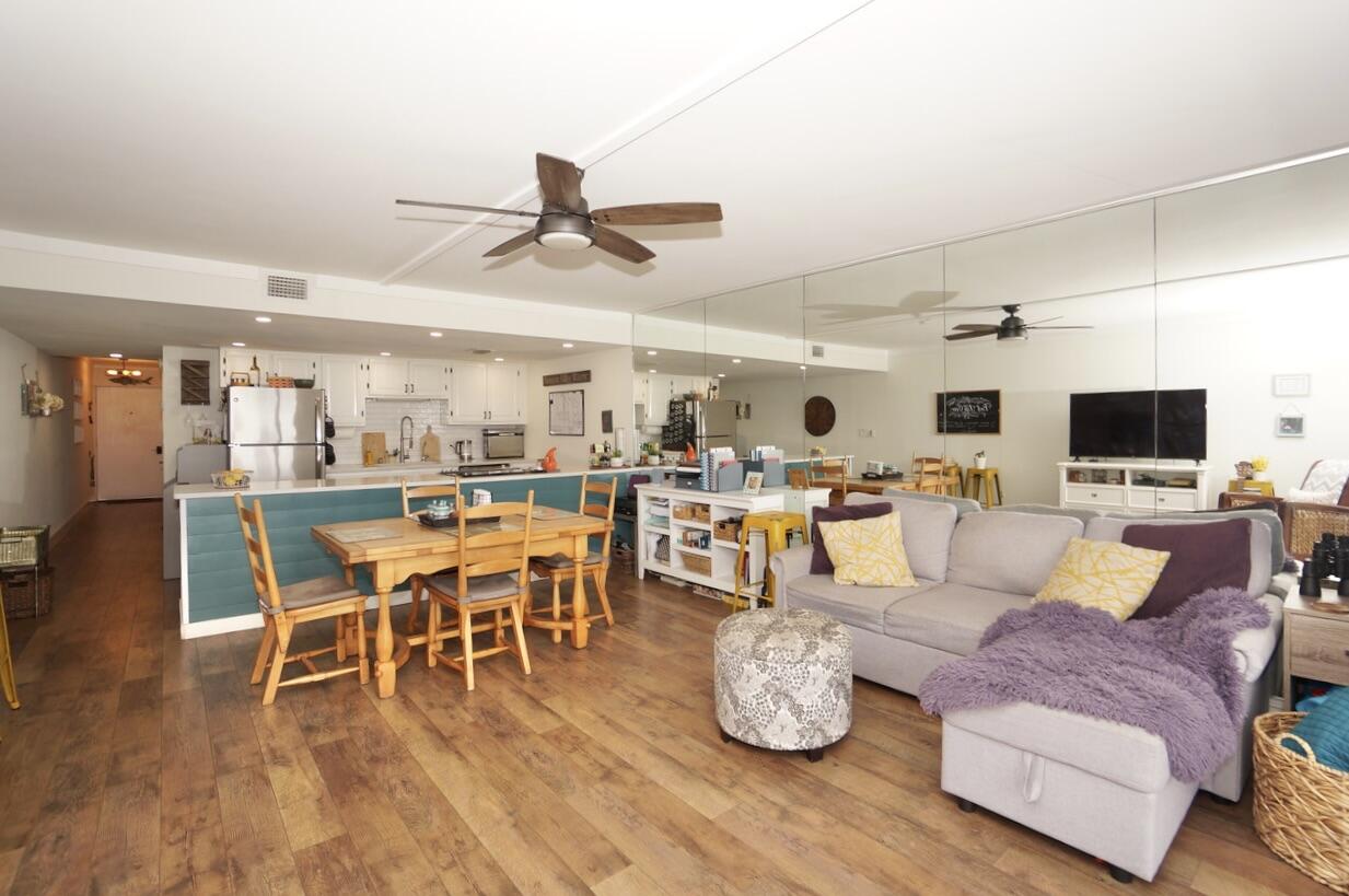 151 Calhoun Avenue, Unit 201 Destin, FL 32541 - Photo 10 of 55 a living room with furniture kitchen view and a wooden floor