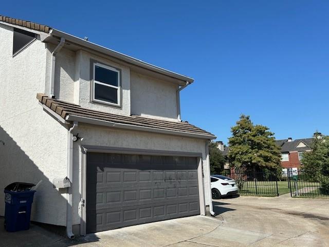 17119 Upper Bay Road Addison, TX 75001 - Photo 27 of 29 a view of a house with a garage