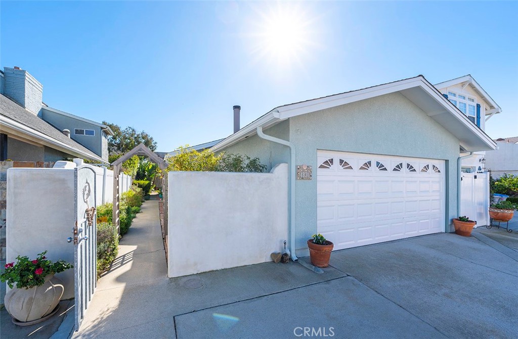 a view of a street with potted plants