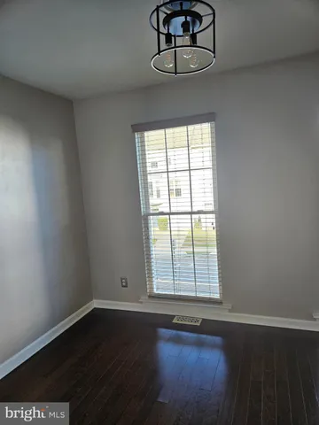a view of a livingroom with wooden floor