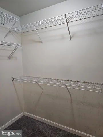 a view of a room with racks on the wall