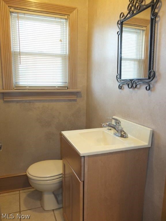 353 Raff Road Northwest Canton, OH 44708 - Photo 13 of 18 Updated half bath on main level with tile floor.