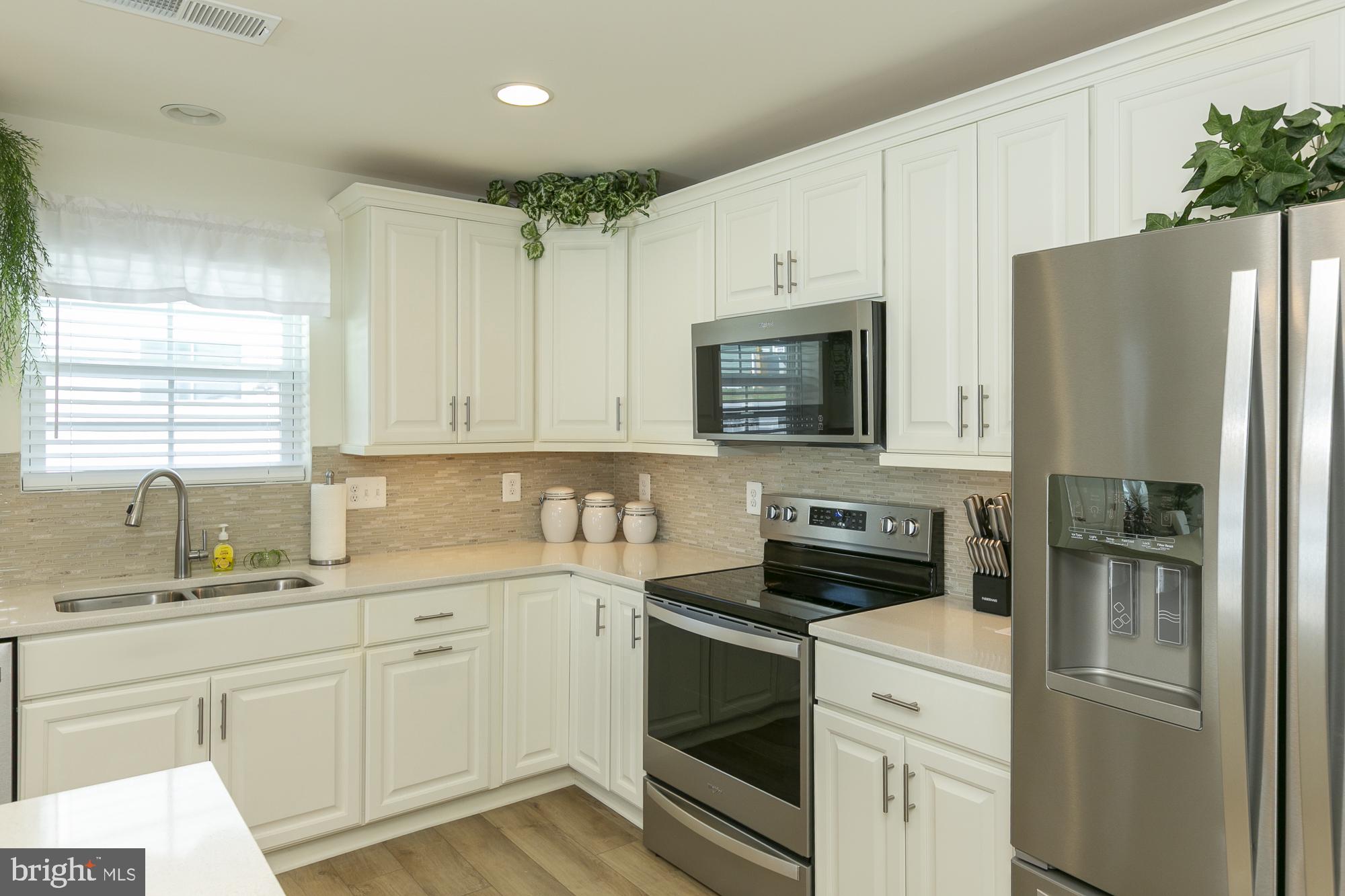 51 Ludgate Manor Falling Waters, WV 25419 - Photo 15 of 59 Modern kitchen with sleek finishes.
