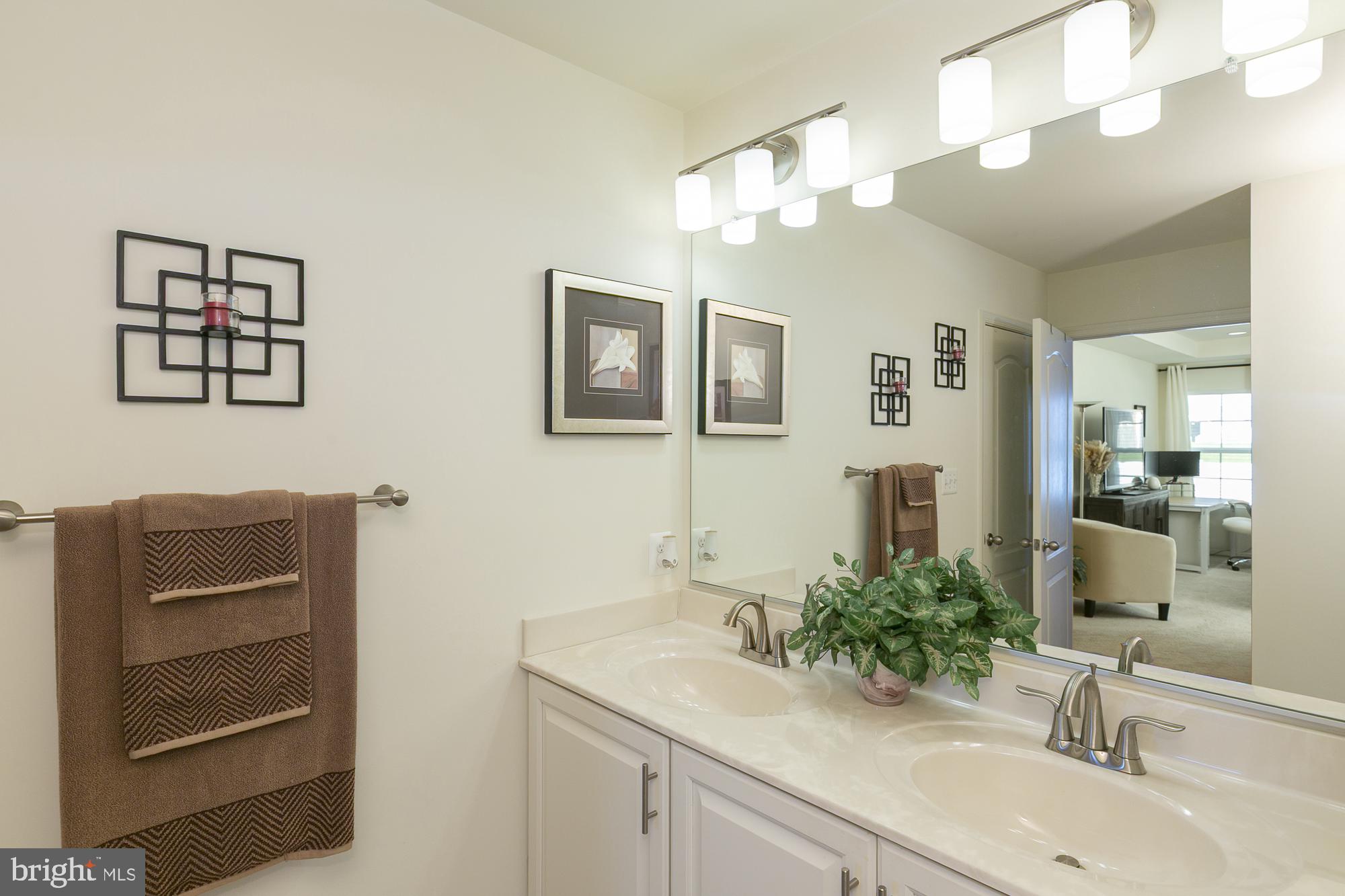 51 Ludgate Manor Falling Waters, WV 25419 - Photo 31 of 59 Elegant dual-sink bathroom retreat.