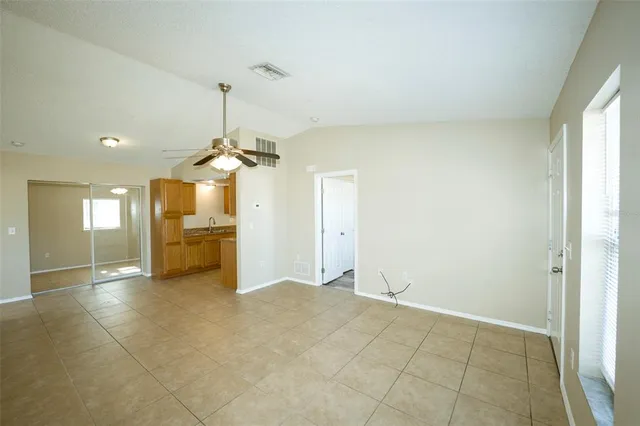 a view of a kitchen with a sink and a chandelier