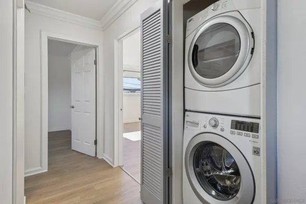 a view of a hallway with washer and dryer